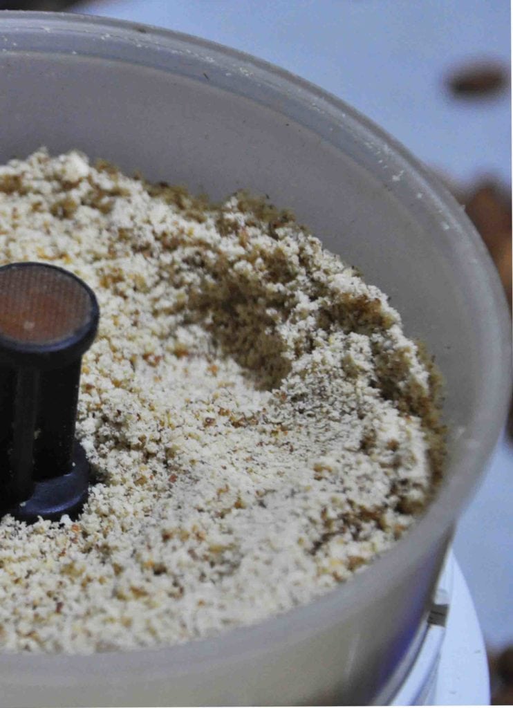 grinding almonds into powder.