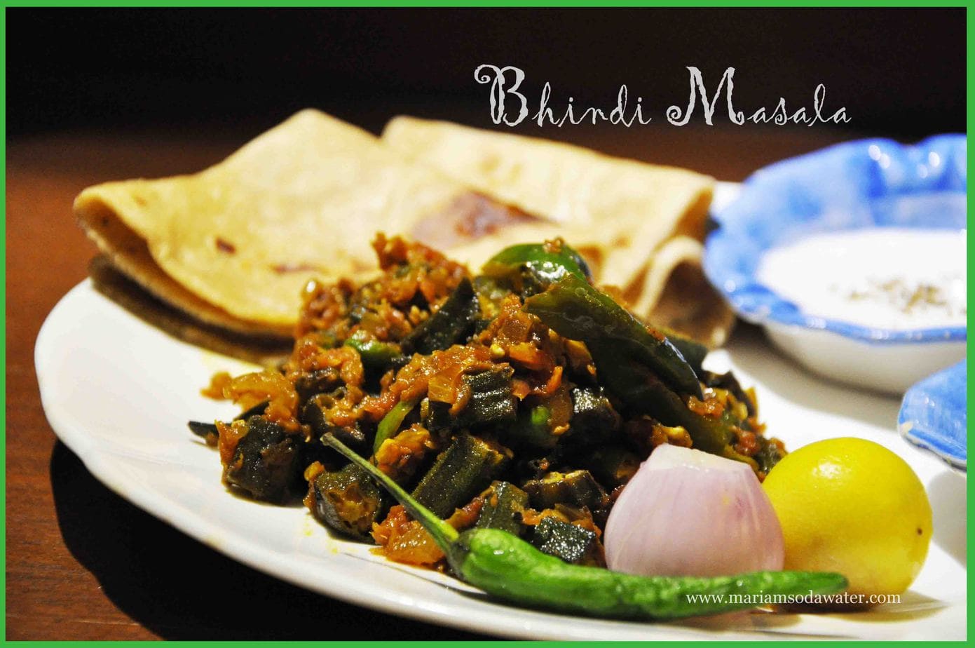 Bhindi served in plate with chapati and chutney served on the side.