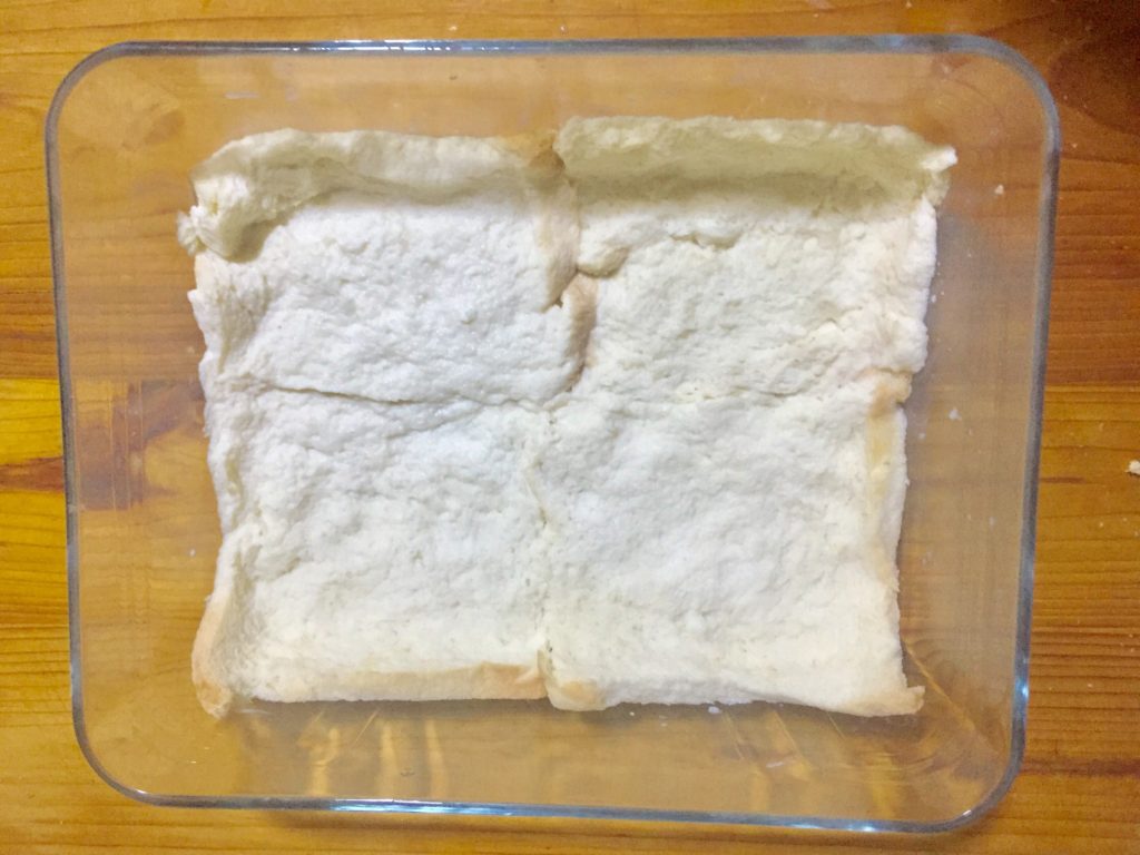 Set bread slices in baking dish.