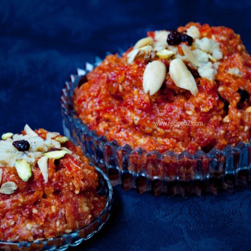 gajar ka halwa served in adish and garnished with nuts.