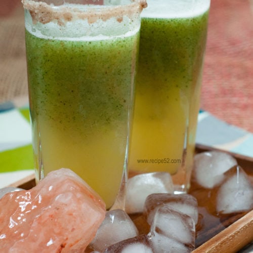 Aam panna served in a tall glass.