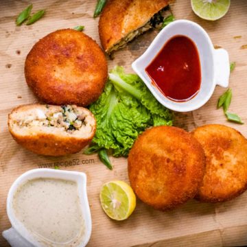 aloo keema patties served with ketchup.