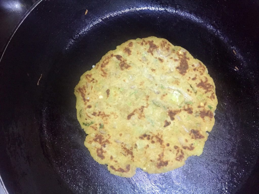 Fry potato roti on a non stick pan.