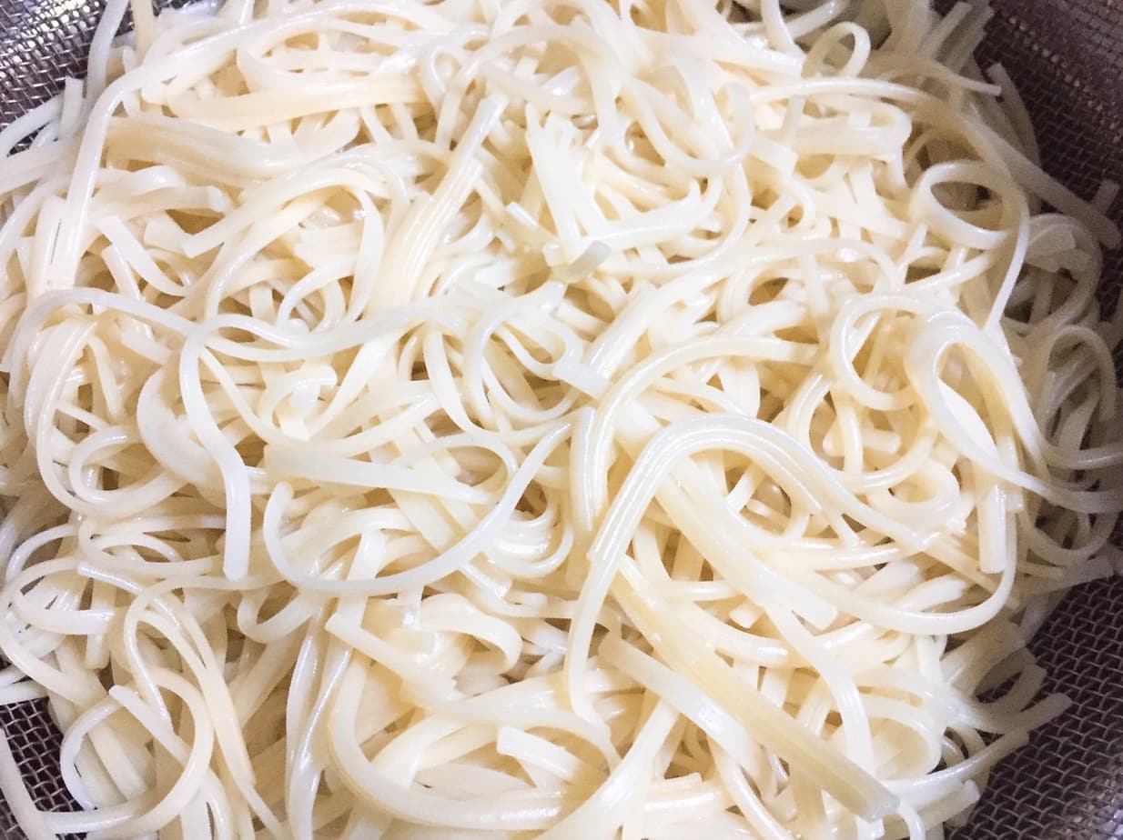 Boil egg noodles for khao soi.