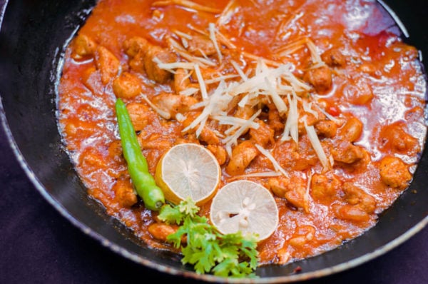 ginger chicken served in wok Close up.