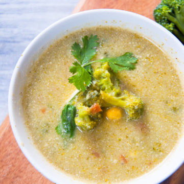 Broccoli potato soup served in bowl.