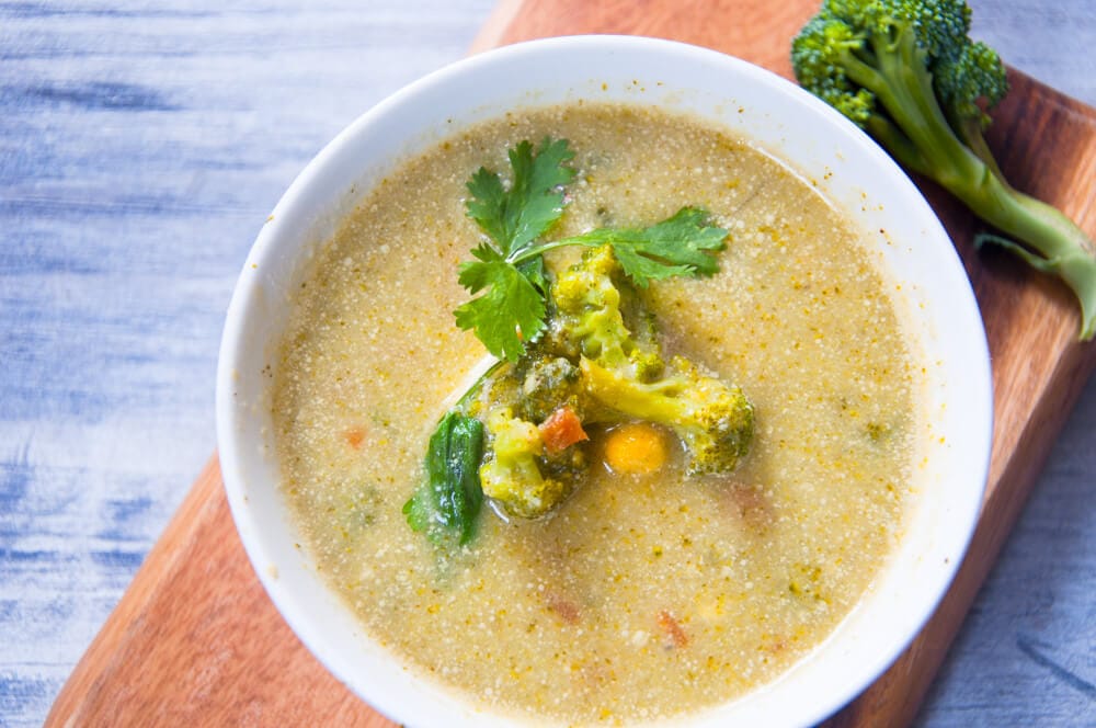 Broccoli potato soup served in bowl.