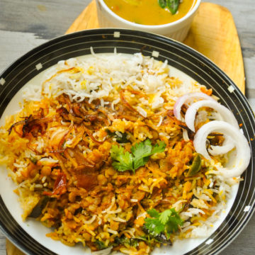 Daal Chawal Palidu served in a plate with palidu in a bowl.