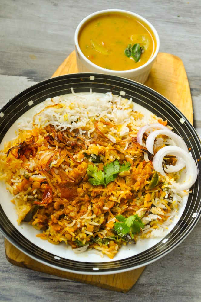 Daal Chawal Palidu served in a plate with palidu in a bowl.