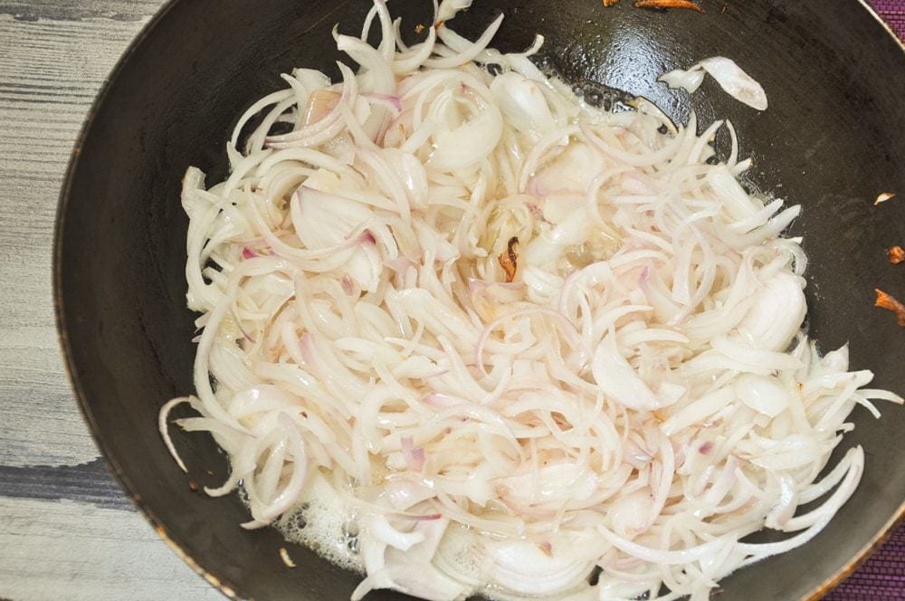 Fry onions until golden.
