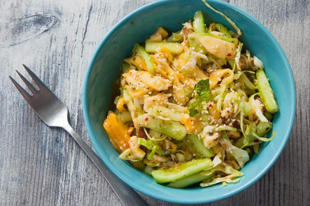 Mango cucumber salad close up in a bowl.