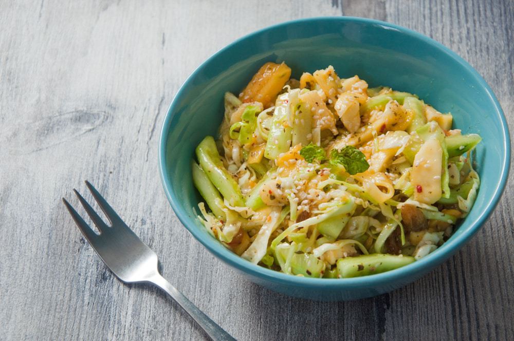 Mango cucumber salad in a bowl ready to eat.