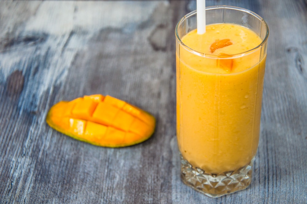 mango milkshake served in glass.