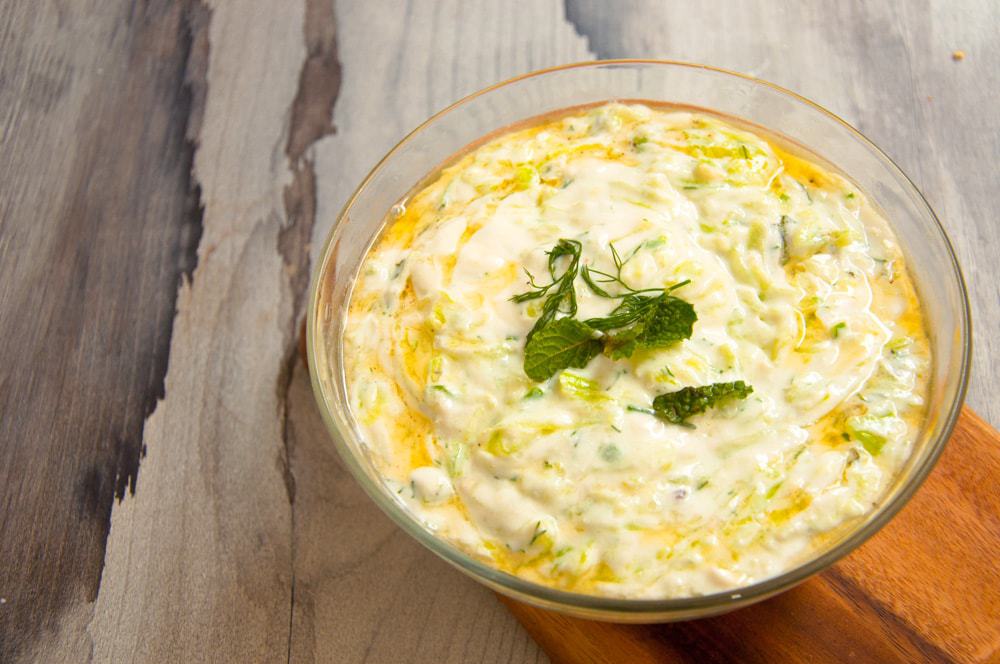 Tzatziki Sauce served in clear bowl.