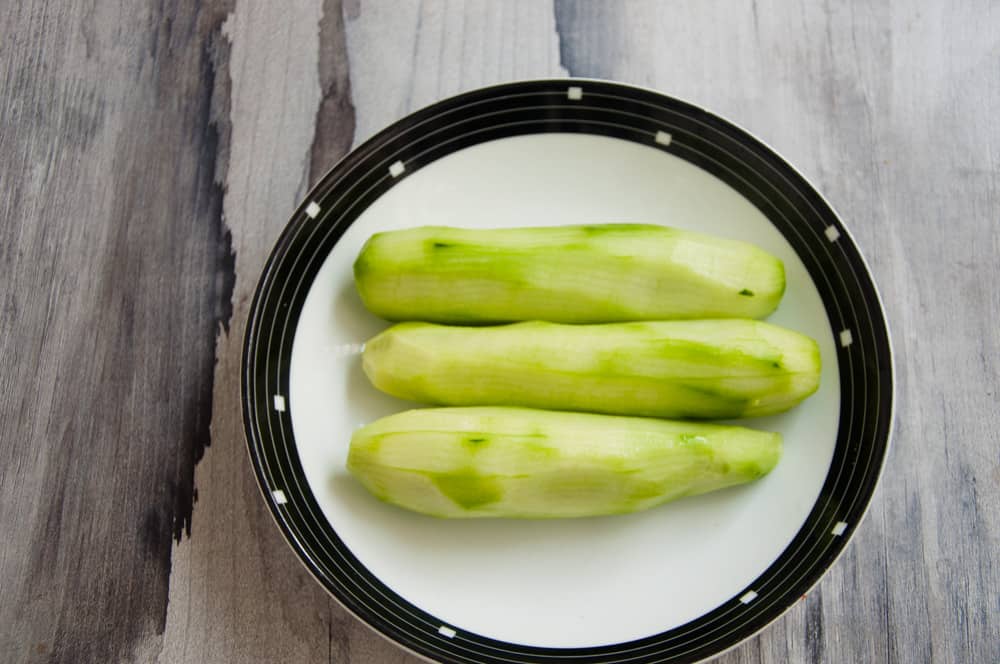 Peeled cucumbers in a plate.