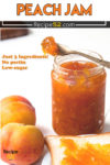 Peach jam in a jar with two fresh Peach on the background.