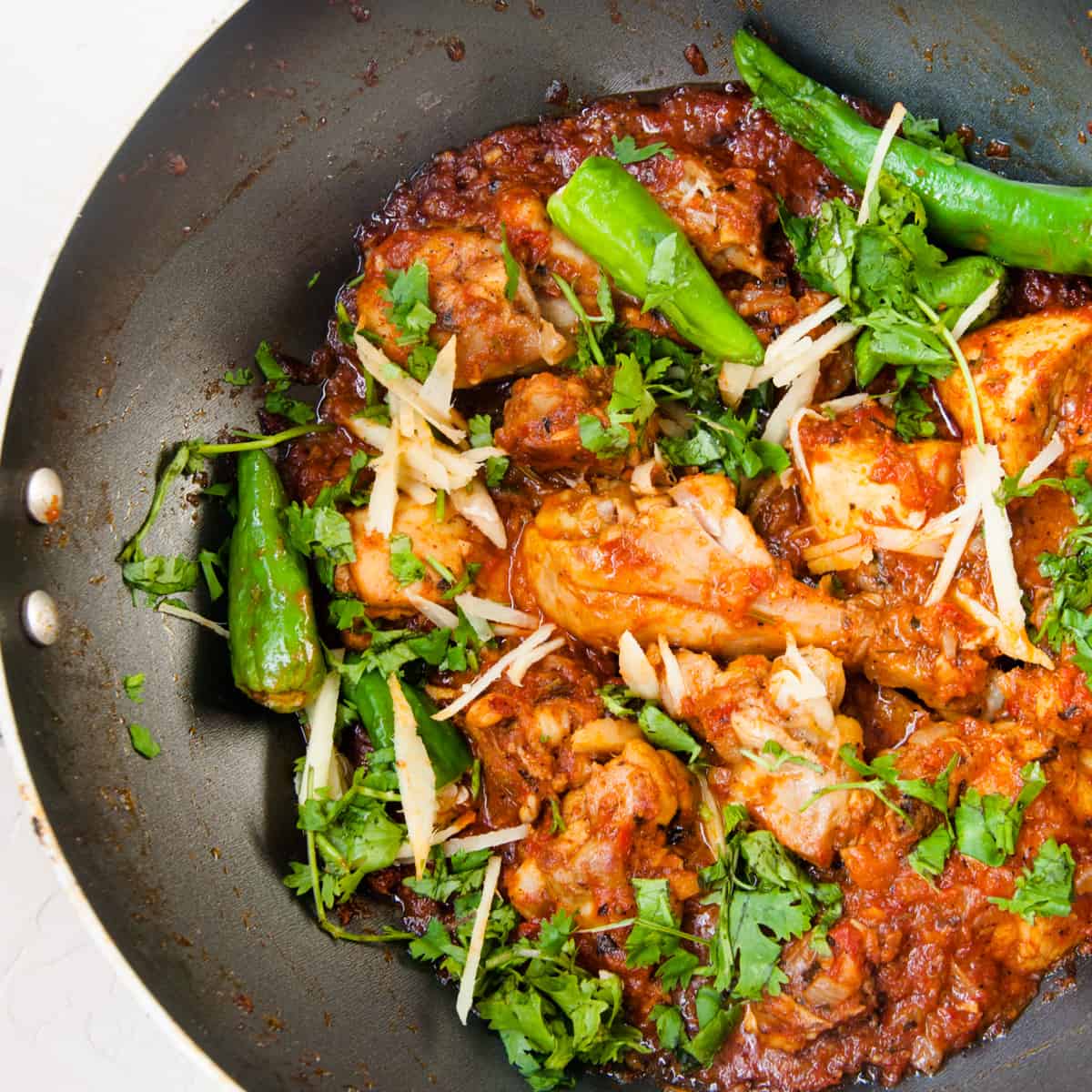Spicy dhaba chicken karahi in the wok.