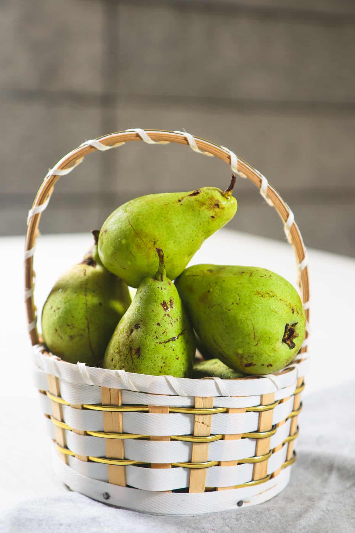 Fresh Pear in a white basket.