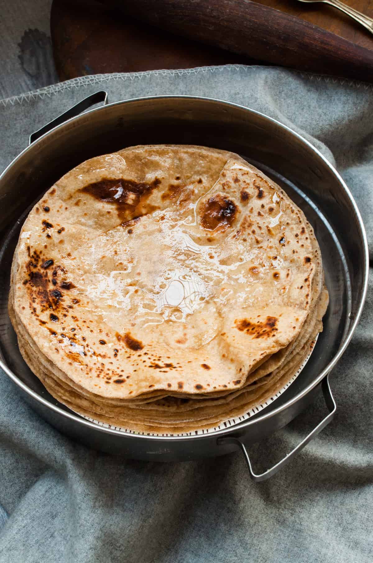 Image of Making Roti (Indian Chapati) On Roti Tawa Made Of Wheat