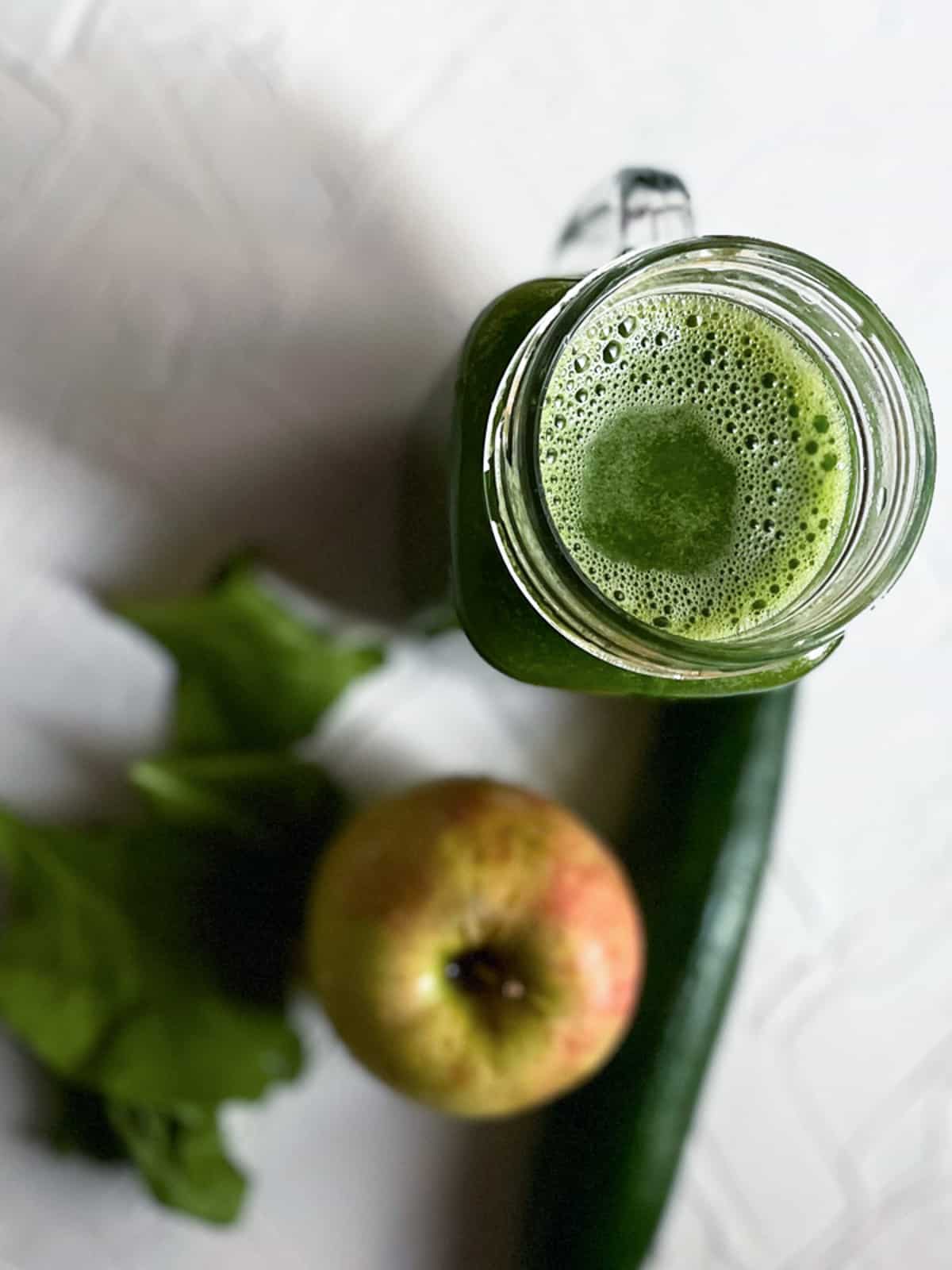 Green detox juice in a jug.