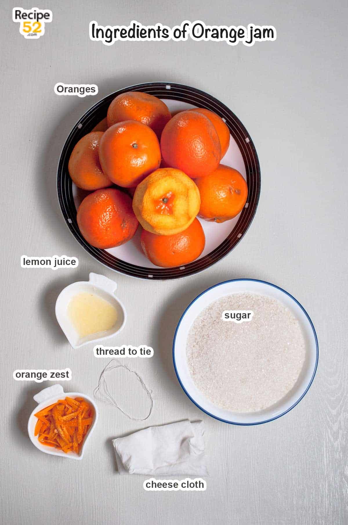 Ingredients of orange jam on the white background.