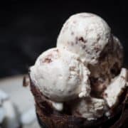 A close shot of two scoops of coconut ice cream.