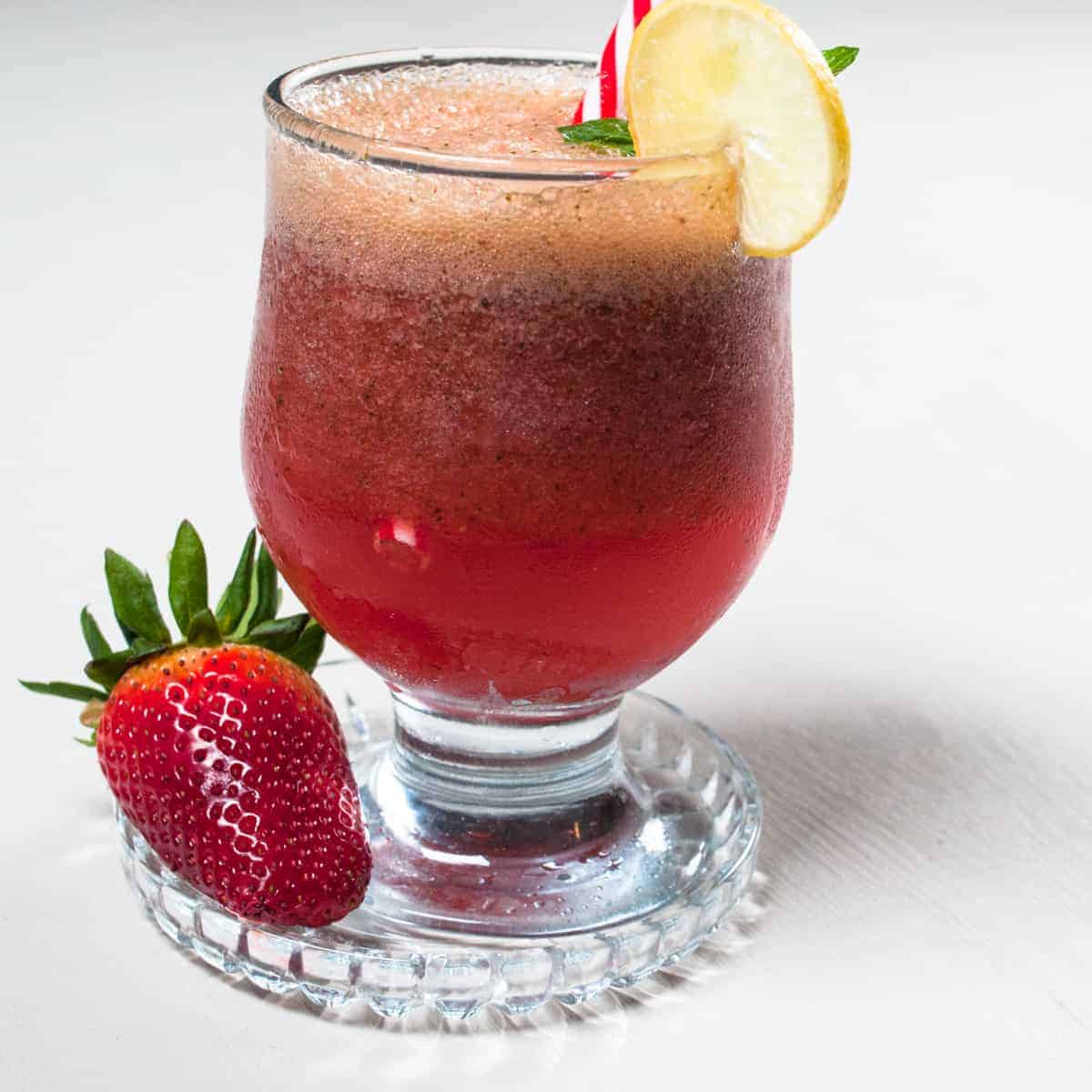 Chilled pink drink served in a glass.