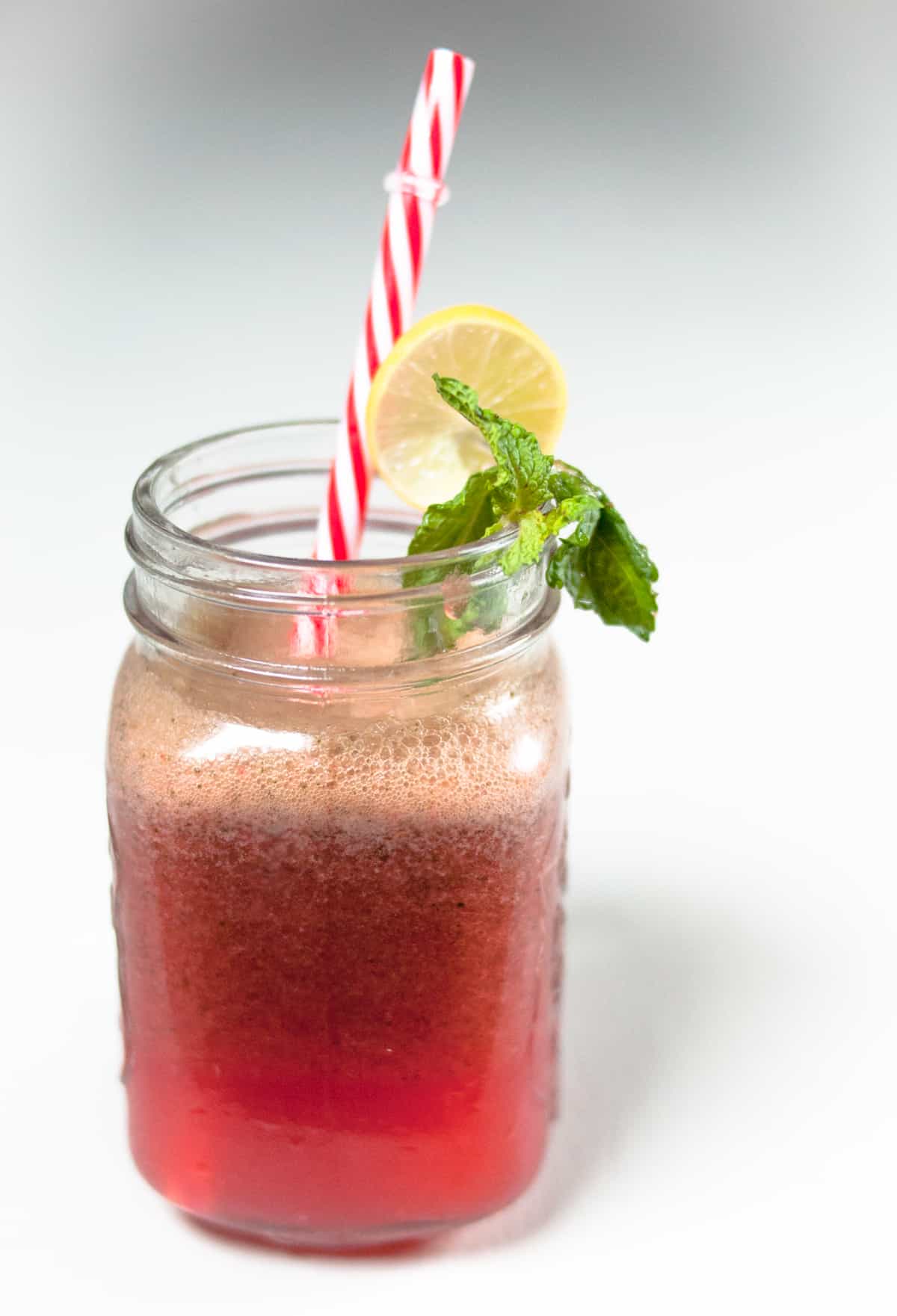 Strawberry mint lemonade served in a jug.