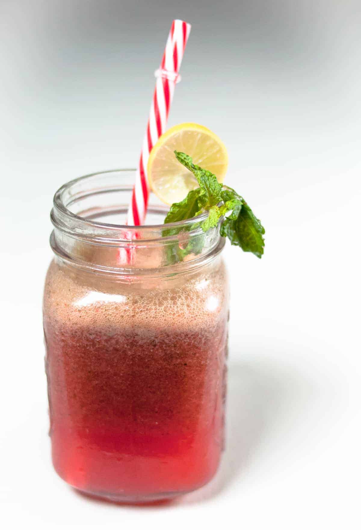 Strawberry mint lemonade served in a jug.