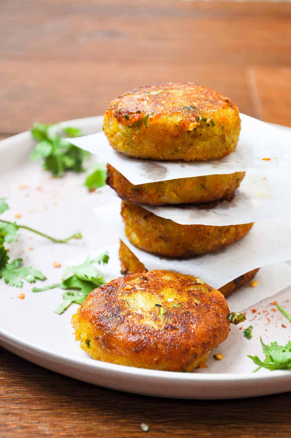 A stack of aloo tikki on the plate.