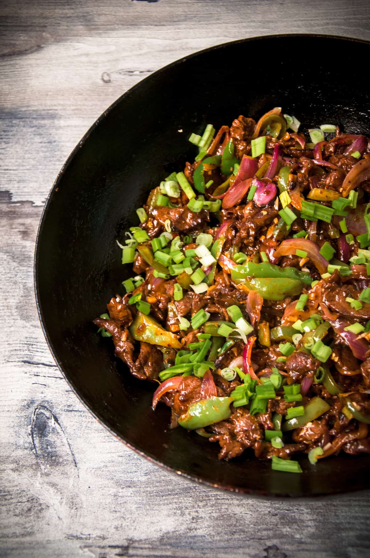 Chinese hot and spicy beed and chili dry in the wok.