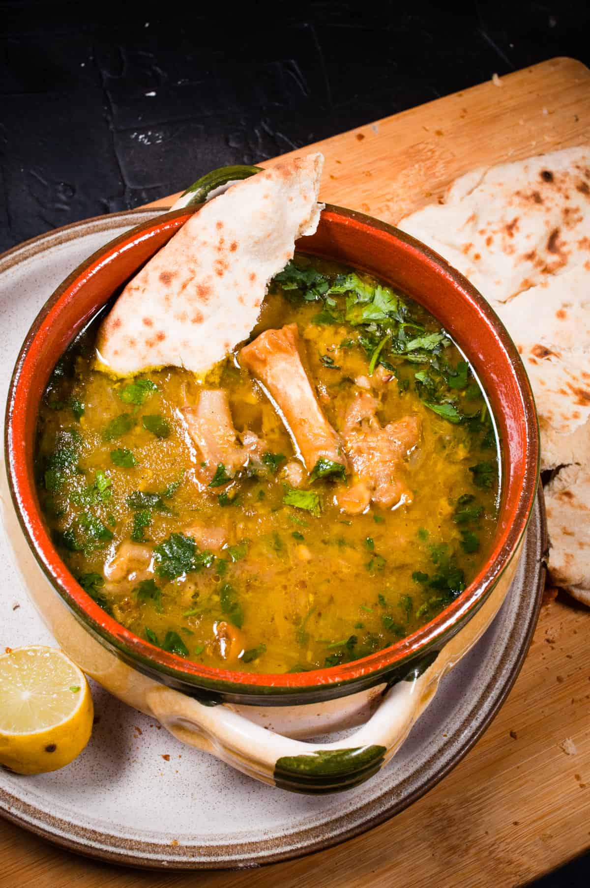 Paya served with naan bread.