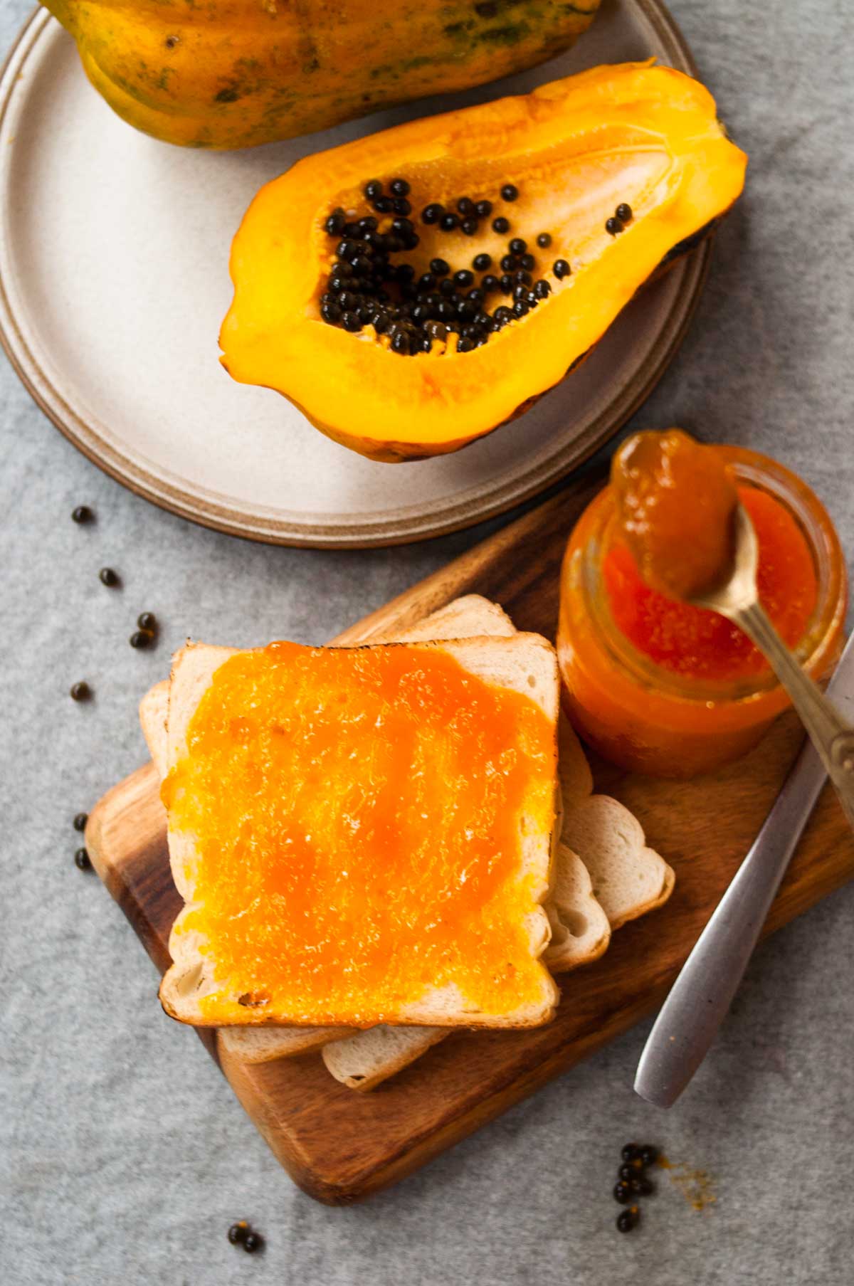 Papaya and the jam on the bread and spoon.
