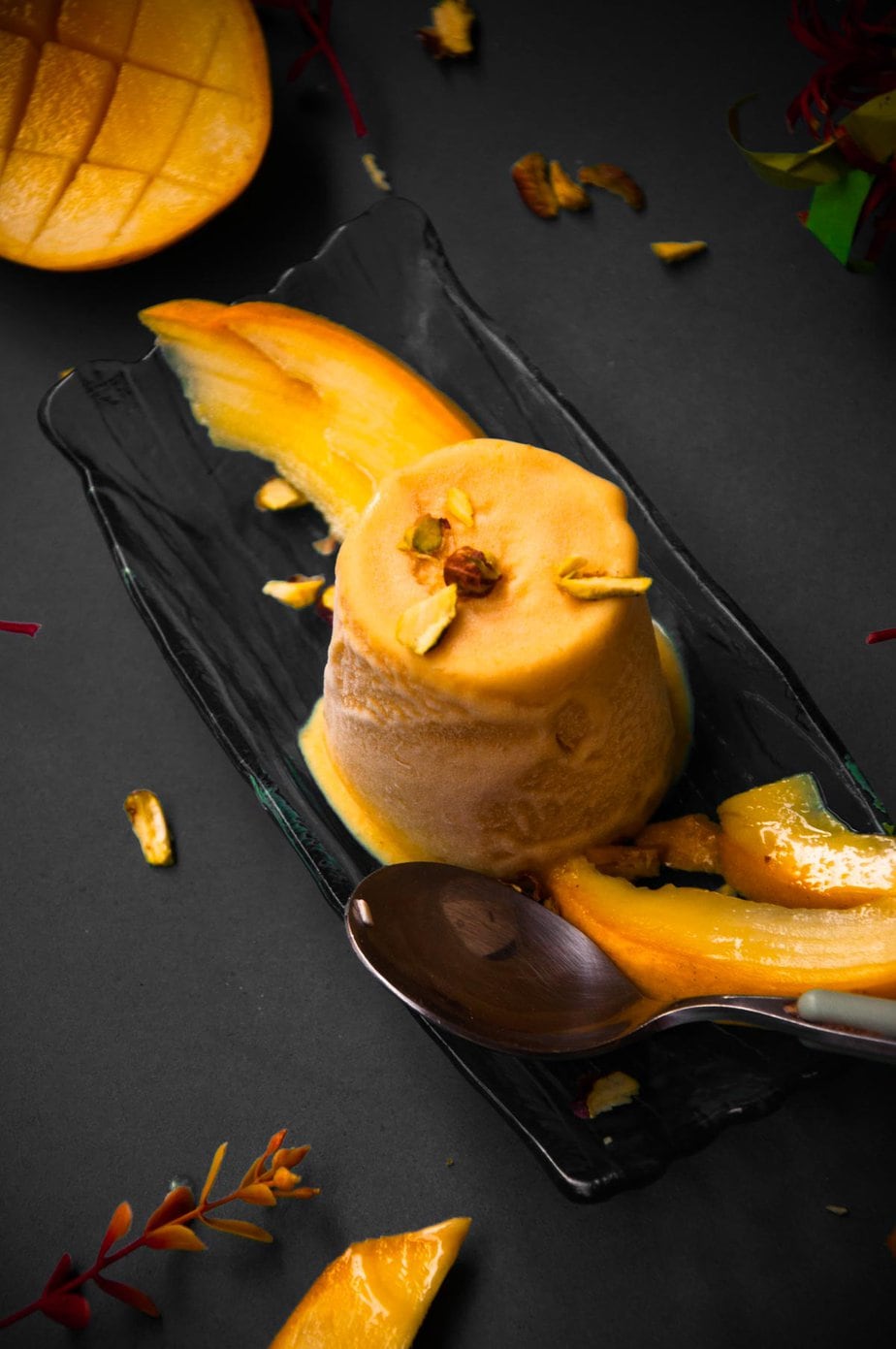 Mango kulfi served in a tray.