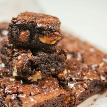A close up shot of walnut brownie stacked on each other.