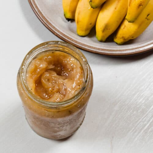 A close up shot of banana jam in a jar.