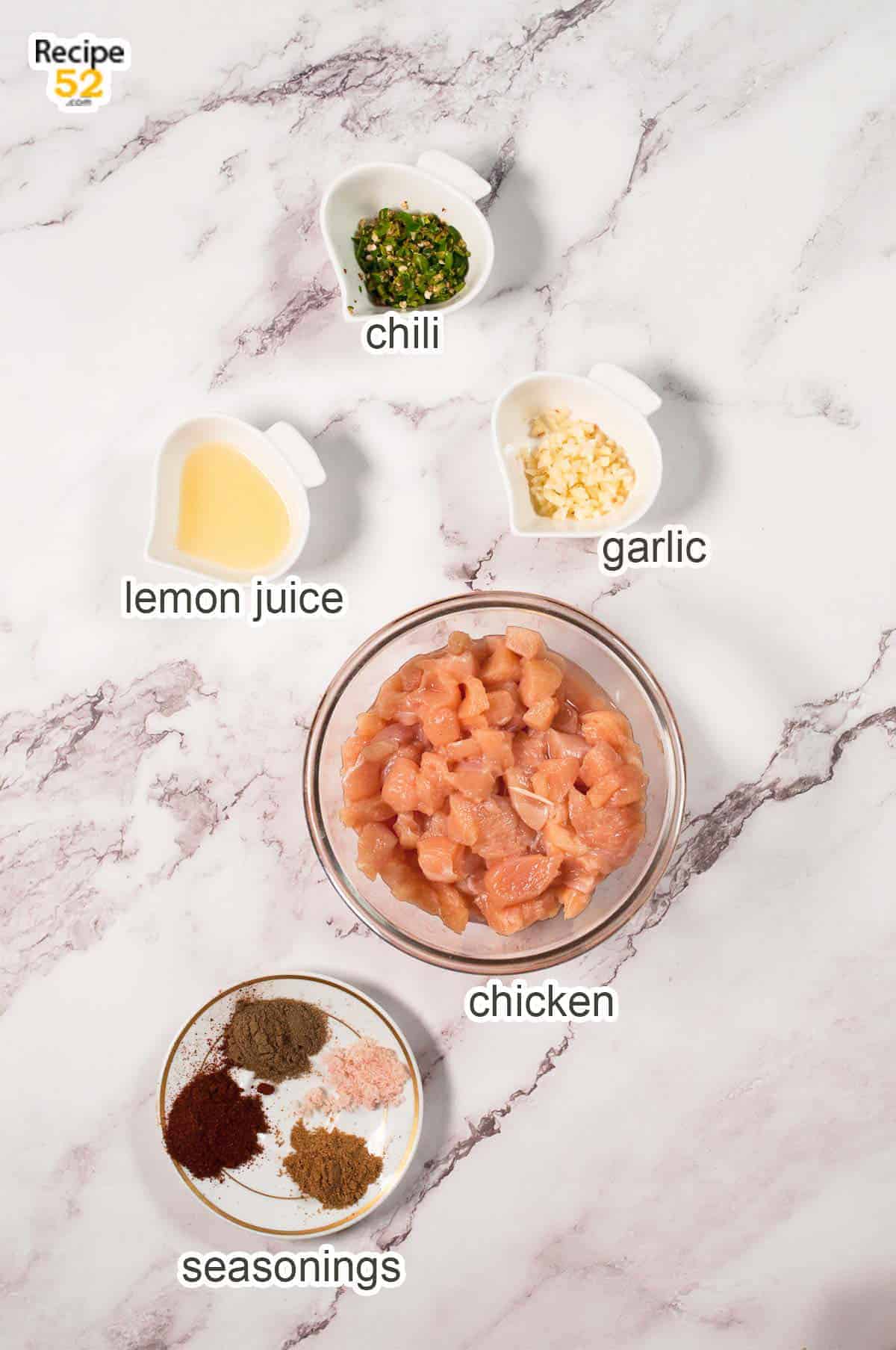Ingredients of chicken on the marble background.