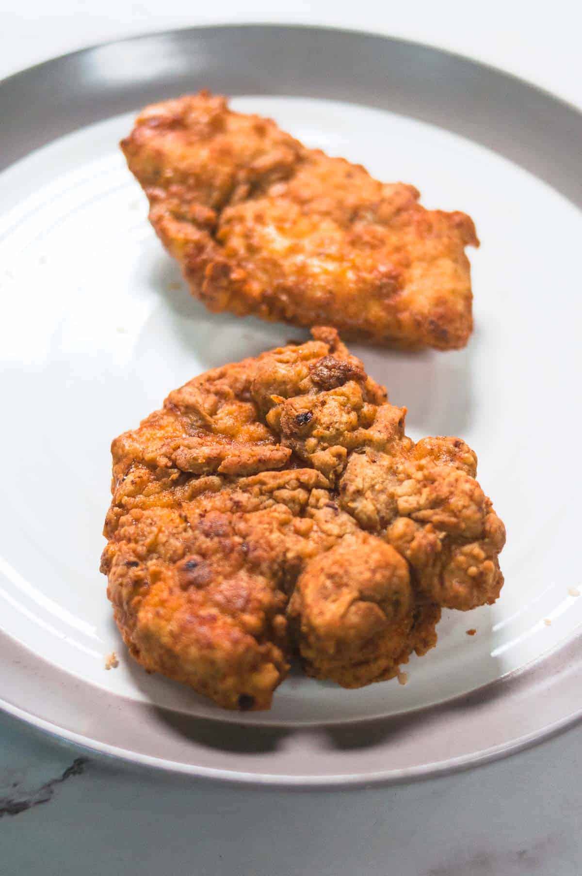 Crispy fried chicken served in a plate.