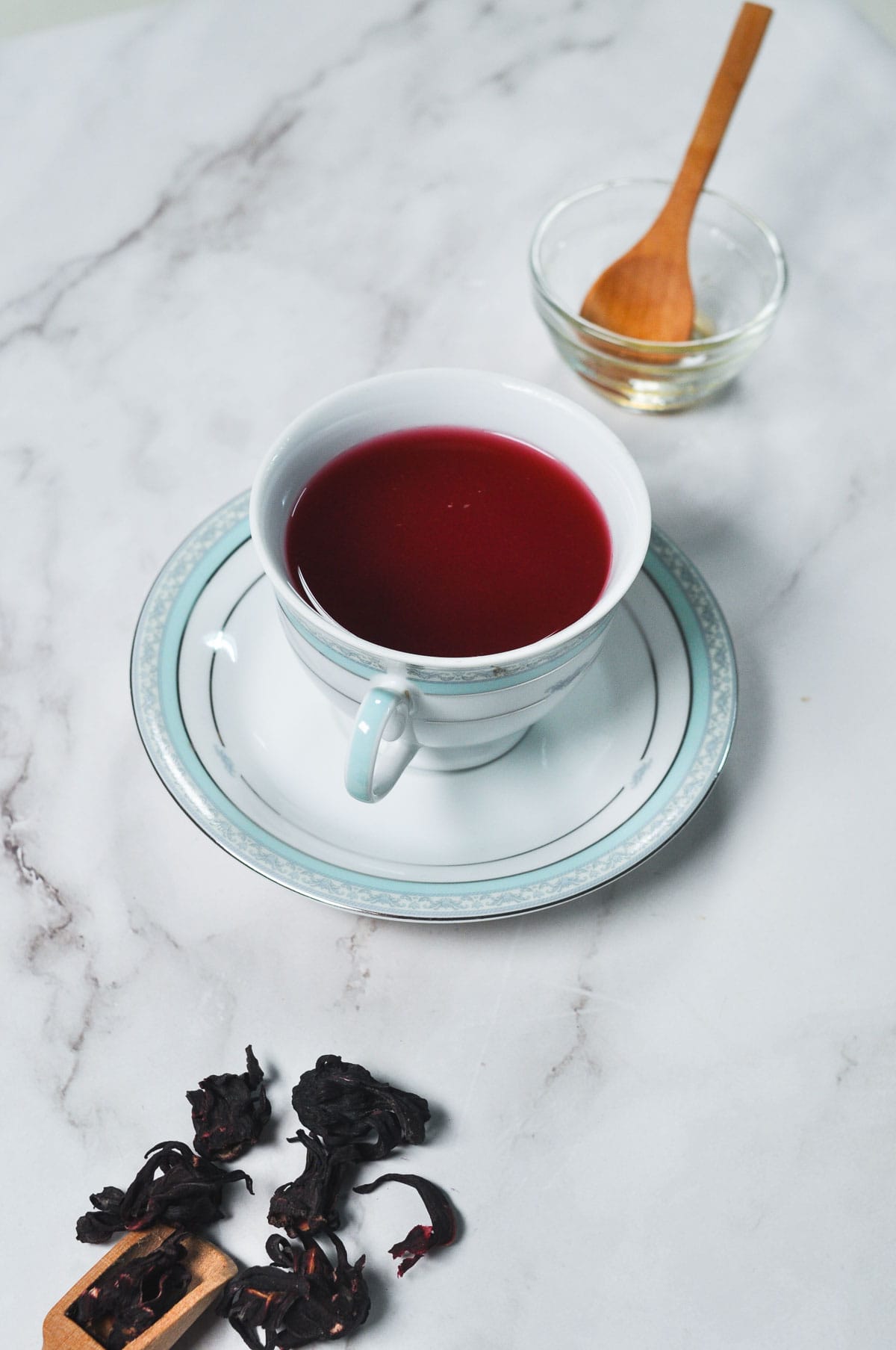 Hot hibiscus tea served in a cup.