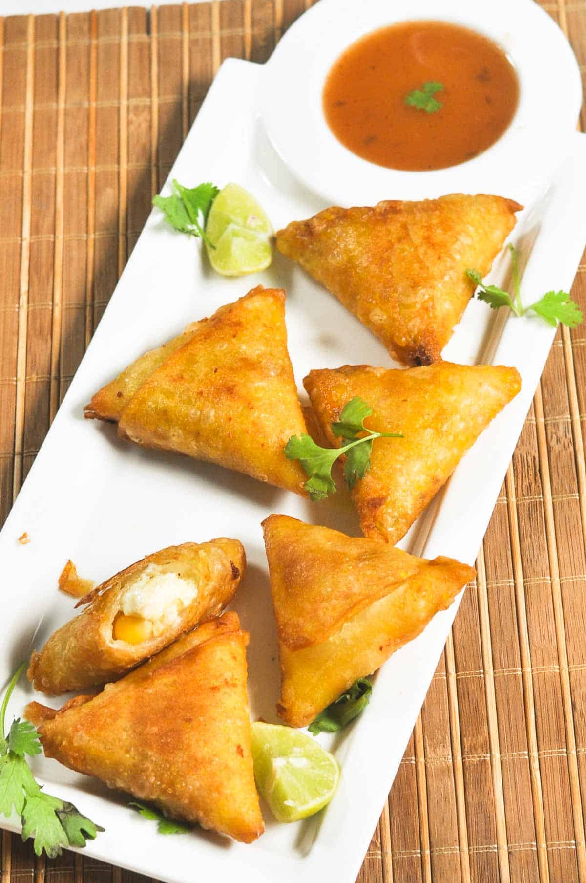 Crispy snack served on a white platter.