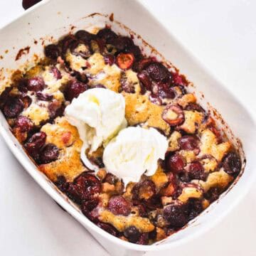 Fresh cherry cobbler with a soft, cake-like topping and juicy cherry filling. This small batch recipe bakes in just 25 minutes and is best served warm with a scoop of vanilla ice cream.